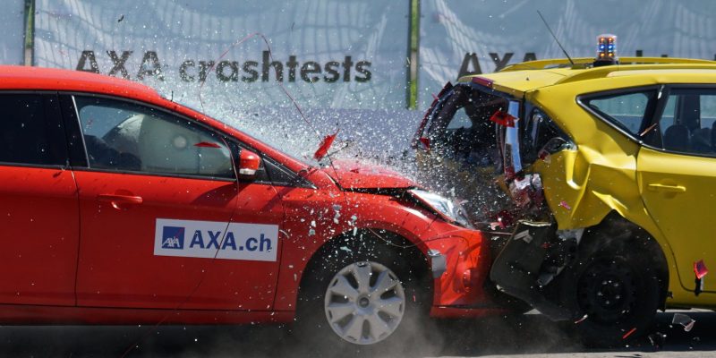 red and yellow hatchback axa crash tests